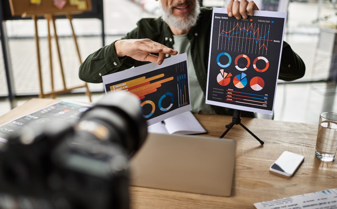 A professional shares insights with charts in a sleek office during a business meeting.